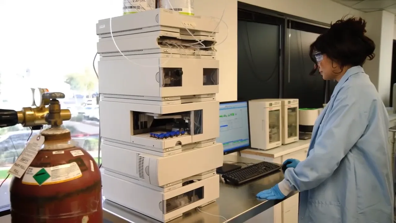 Analyst loading samples into a liquid chromatography system
